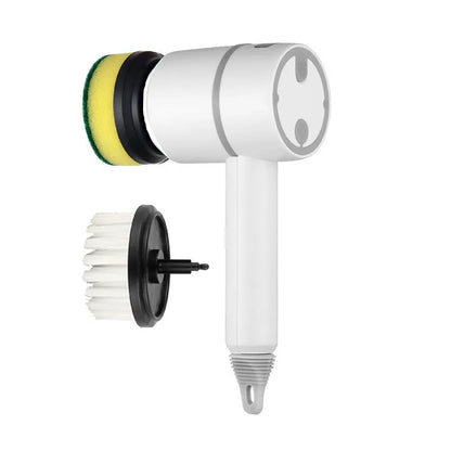 Green electric cleaning brush with multiple brush heads on a kitchen worktop.