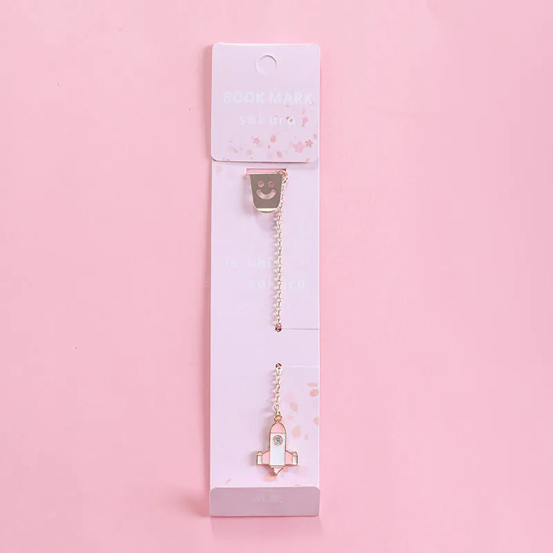 Alloy metal cartoon pendant bookmark with colourful charms including panda, rocket, and wishing bottle designs