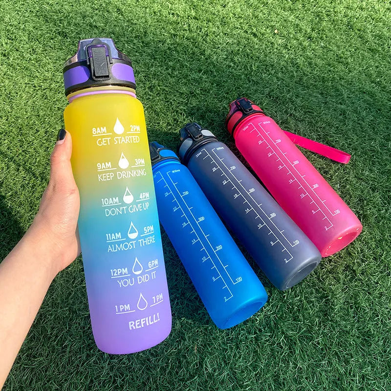 1 litre Tritan sports water bottle with time marker and flip-top leakproof lid, featuring an inspirational bounce cover for motivational hydration during cycling, running, gym workouts and office use, available in multiple solid and gradient colours.
