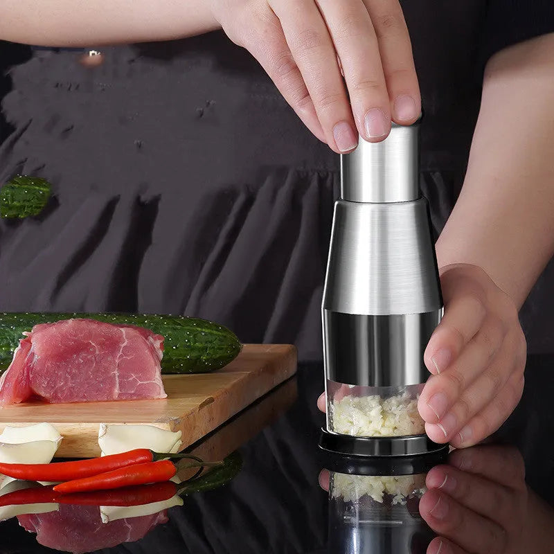 Black manual garlic press and onion chopper with stainless steel blades measuring 6x16cm