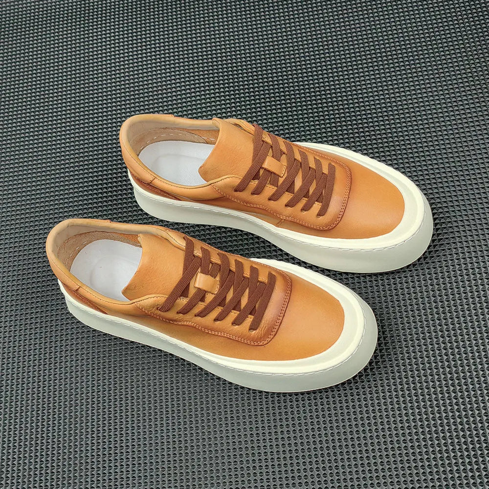 Men's white genuine cowhide board shoes with a thick rubber platform sole and round toe.