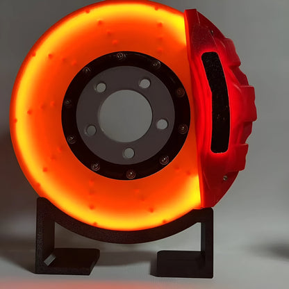 Brake disc design LED night light with caliper details in blue, red, or yellow colour options on desktop