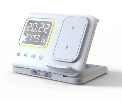 Black wireless charging station showing phone, watch and headphones charging, with digital clock display.