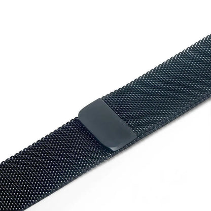 Stainless steel Apple Watch strap in silver on a wrist, showing the metal links and secure clasp.
