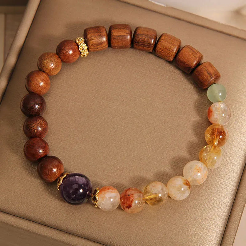 Women's crystal bracelet with yellow tower crystal, ebony amethyst beads, pearl and rhinestone decoration