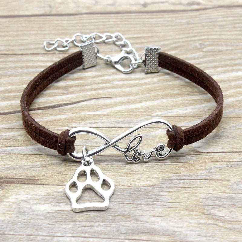 Stylish hand-woven infinite love pet bracelet in various colours, featuring a bow design and made of premium alloy materials