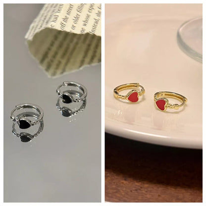 Black love heart earrings for women with alloy construction and ear clip design