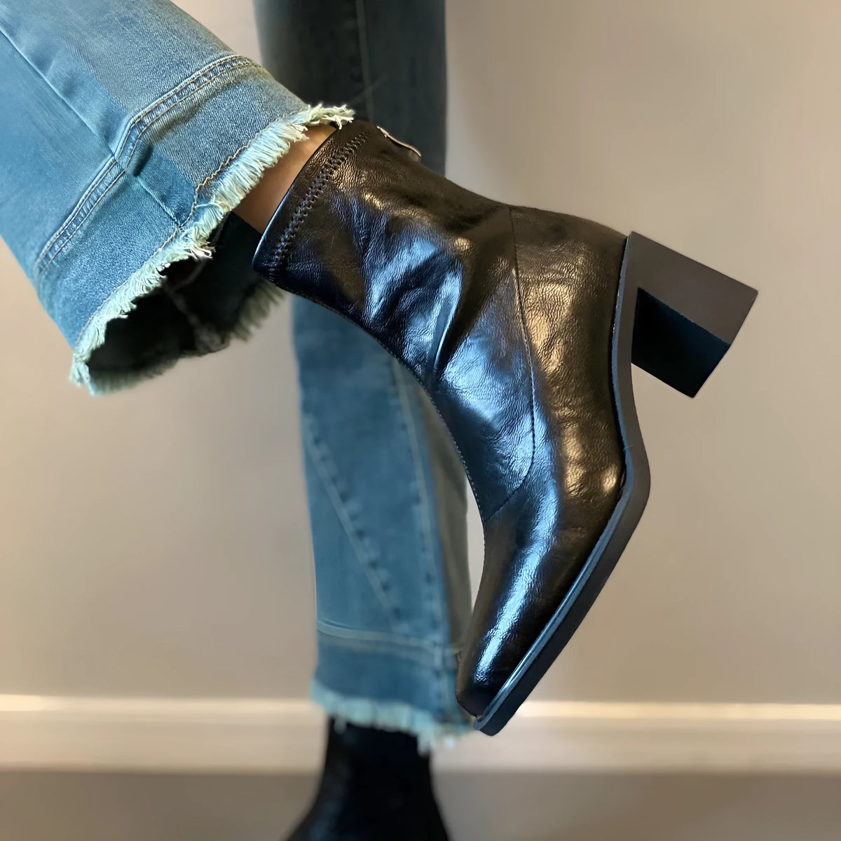Women's retro ankle boots with chunky mid heel, square toe, back zipper, black microfibre upper, rubber sole.