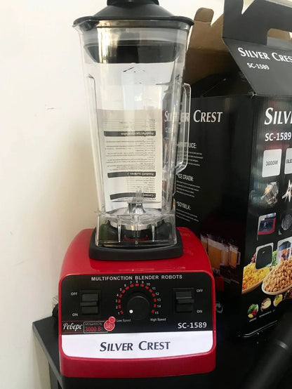 Red multifunctional juicer blender with 3000W motor, container, and base for kitchen food processing