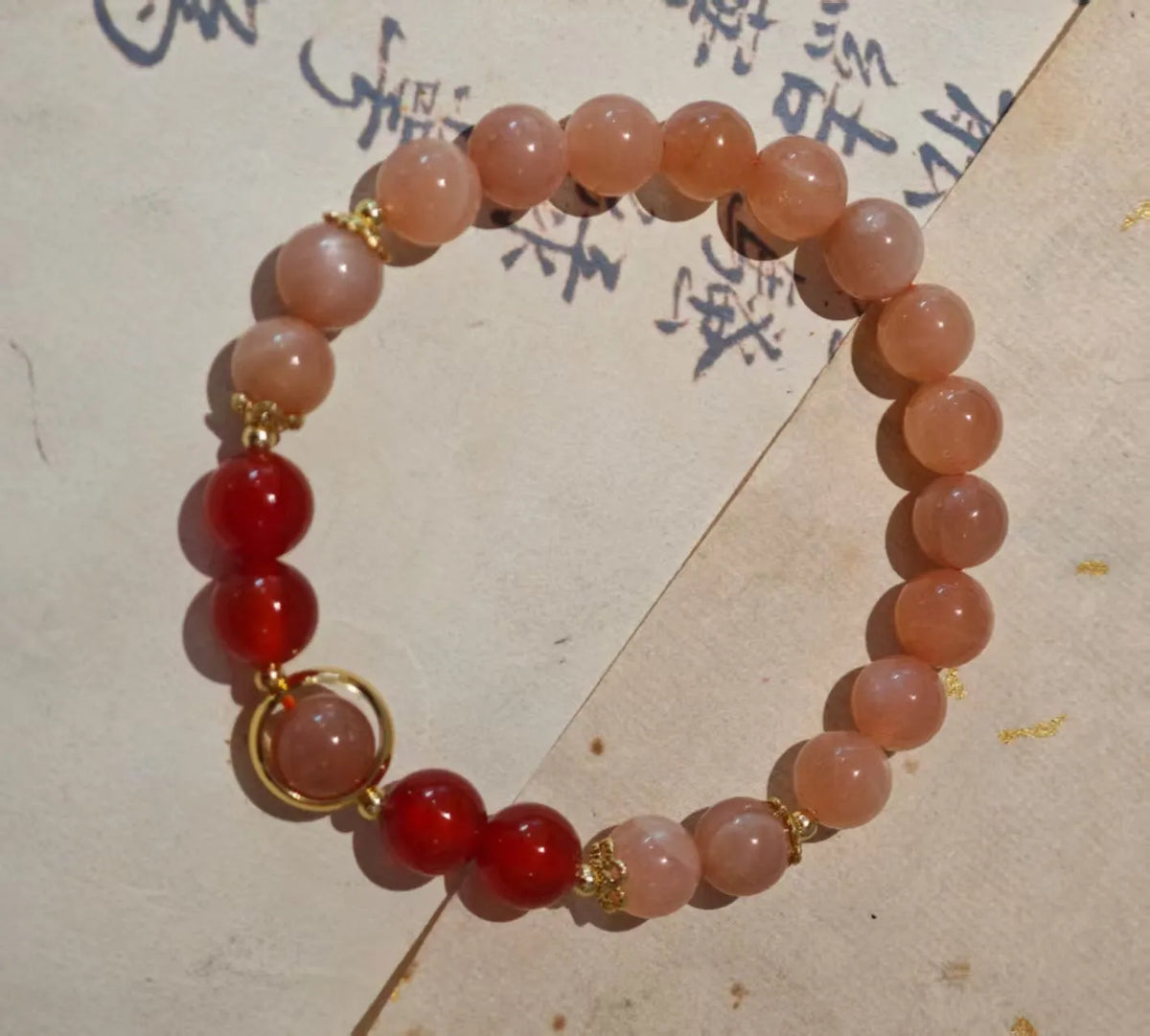 Handmade red agate and sunstone ethnic bracelet with star and Xiangyun designs for women
