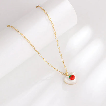 Geometric fruit heart pendant necklace on an adjustable chain, showing strawberry, pineapple, apple, pear, and cherry design options.