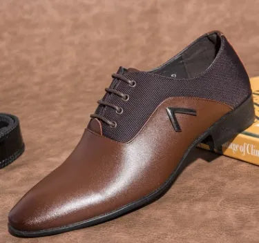 Men's black Oxford dress shoes with a classic toe cap and rubber sole, shown on a wooden floor.