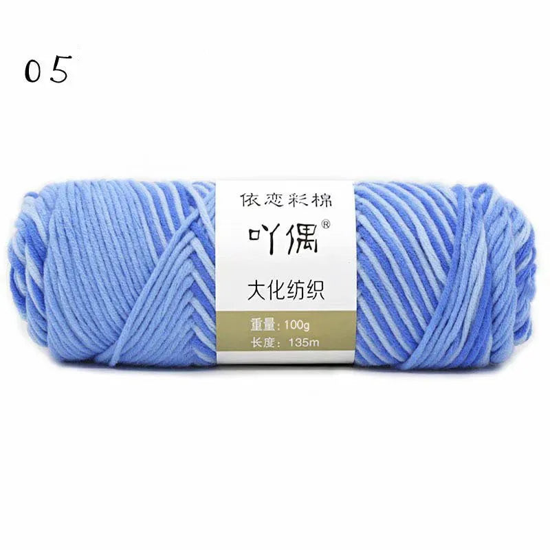 Eight strands of gradient milk cotton wool in a ball, showing multiple colour options for hand knitting.