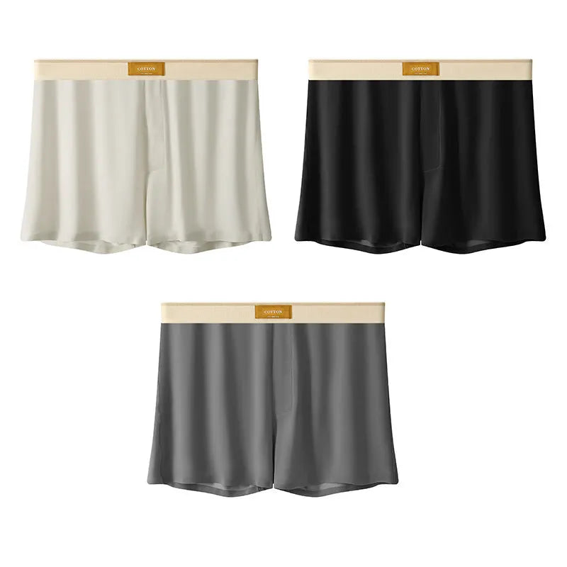 Pack of three pairs of solid colour men's ice silk briefs on a white background