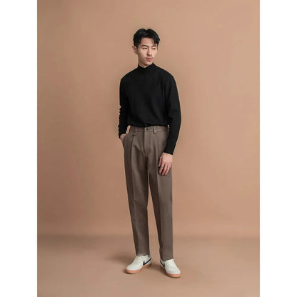 Man wearing straight-leg casual trousers in khaki, showcasing the modern fit and lightweight polyester fabric.