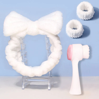 Facial brush set with coral fleece hair band and four nylon-bristle brushes in purple, grey, white, or pink colours