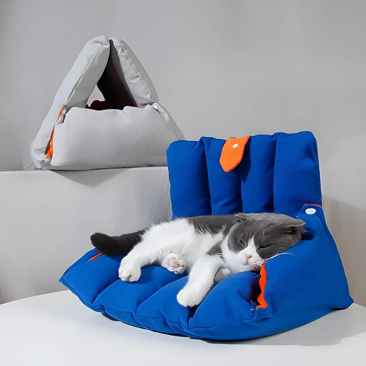 Blue triangular cat bed with drilled connectors and removable cotton cover
