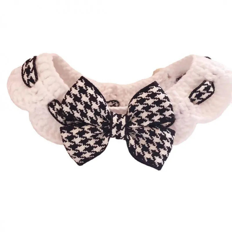 Red and black houndstooth patterned wool knitted collar for pets on a white background.