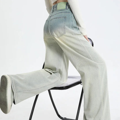 Women's gradient blue denim straight-leg trousers with 100% cotton fabric, showing colour transition and straight-leg silhouette
