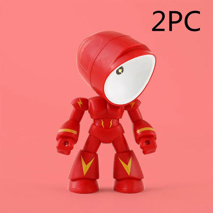 Mini mecha robot hero LED night light with adjustable arms on a desk.