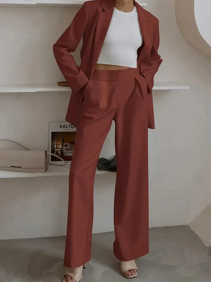 Tailored ladies' suit in various colours, featuring a jacket and trousers made of premium polyester fabric.