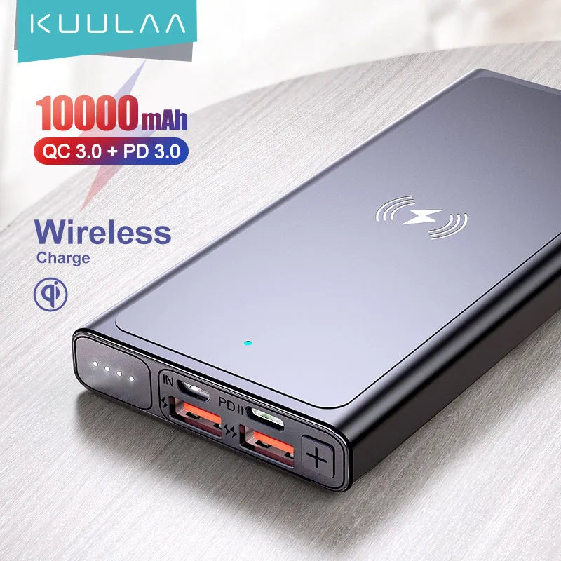 Black and blue alloy 10000mAh power bank with wireless charging surface and integrated plug.