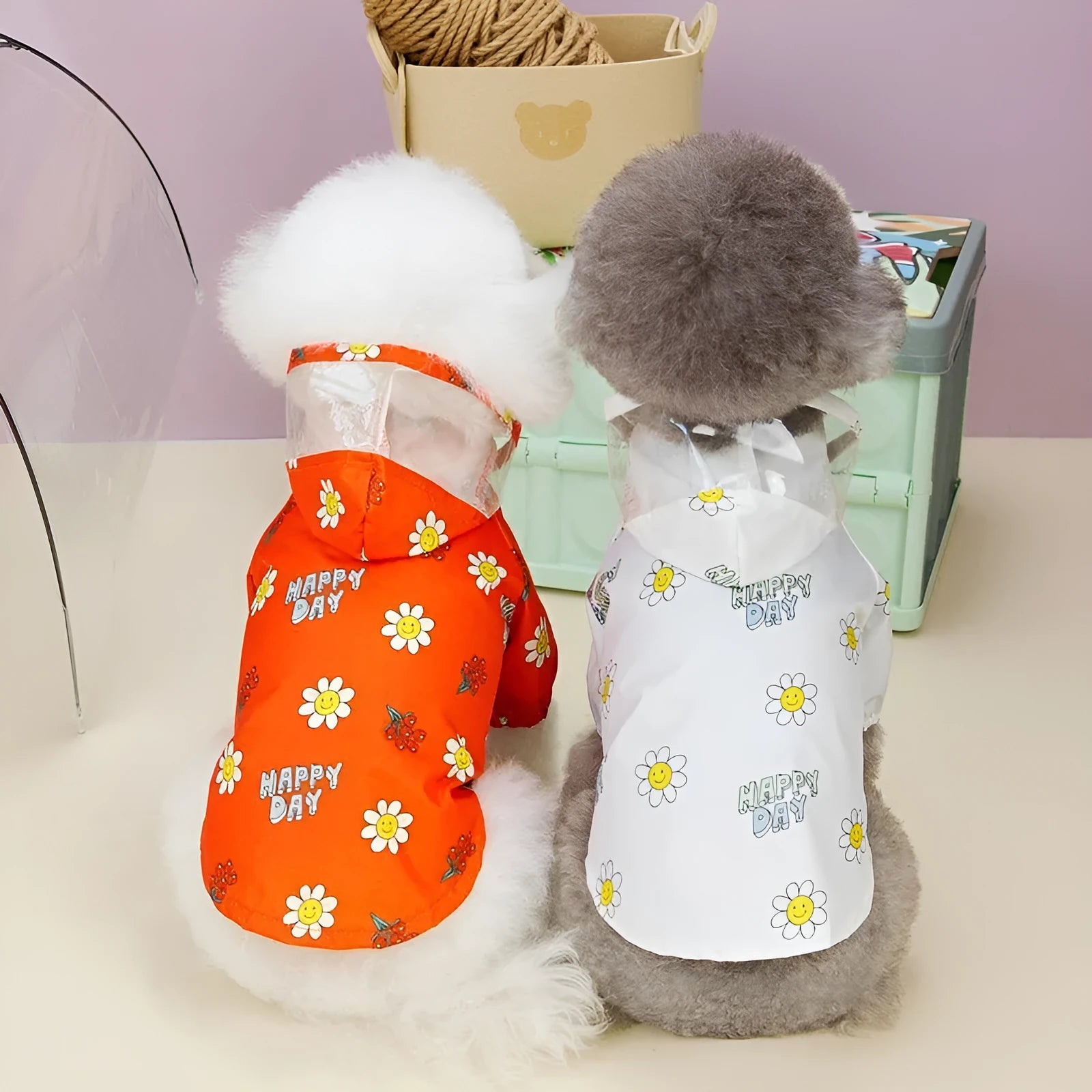 Transparent dog raincoat with small flower pattern and pull ring traction system