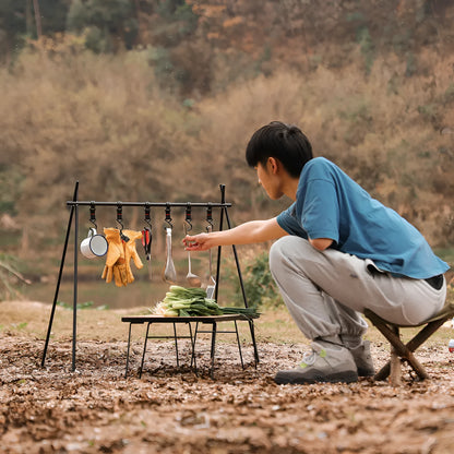 Aluminium alloy folding clothes drying rack with triangle frame and side hanger hooks for camping.