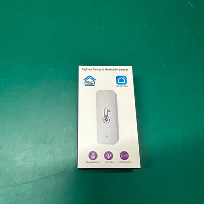 Compact white ABS plastic WiFi and Zigbee temperature and humidity sensor for smart homes.
