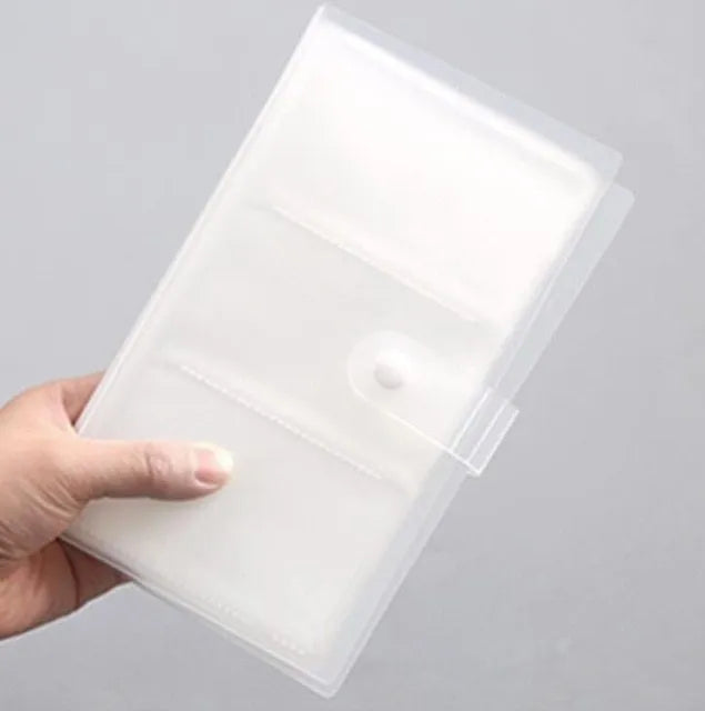 Business card holder book with protective PVC and PP shell for standard UK business cards, measuring 190mm x 120mm for A6 storage, featuring a smile logo design and available in blue, green, light purple, pink, and purple colour options.