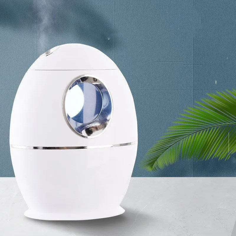 White columnar air disinfection humidifier with USB cable on wooden surface