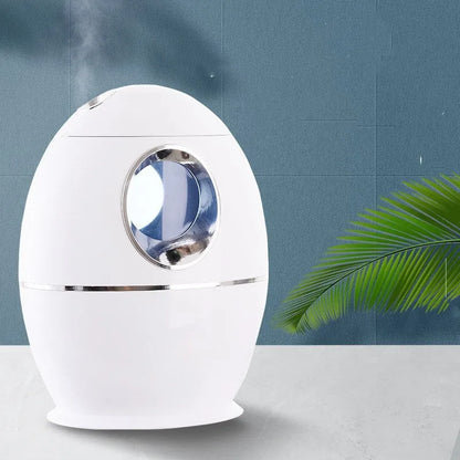 White columnar air disinfection humidifier with USB cable on wooden surface