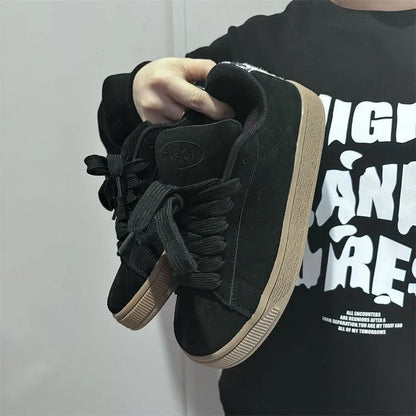 Black retro low-top sneakers with artificial PU upper, round toe and lace-up front closure on rubber sole