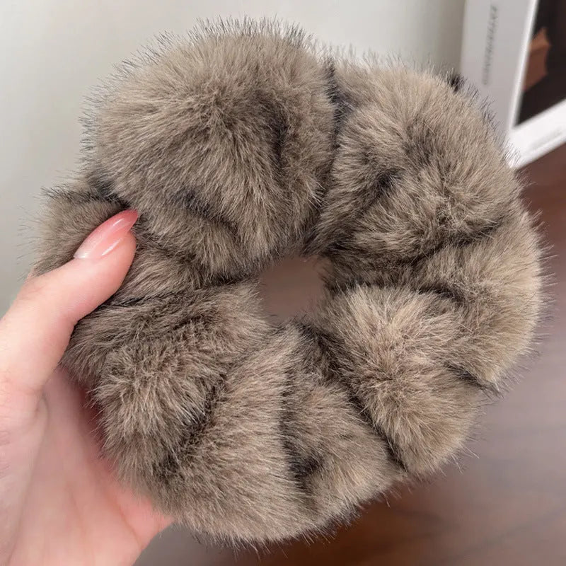 Large intestine coil hair band in mink-like waterproof fabric on a white background.