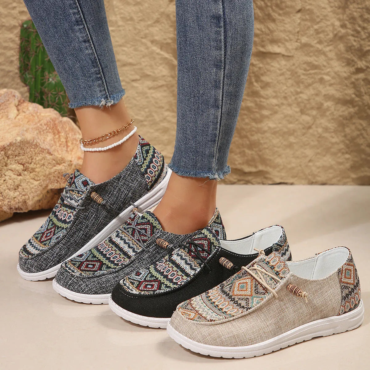 Women's black slip-on flat shoes with round toe and low-top design on a neutral background.
