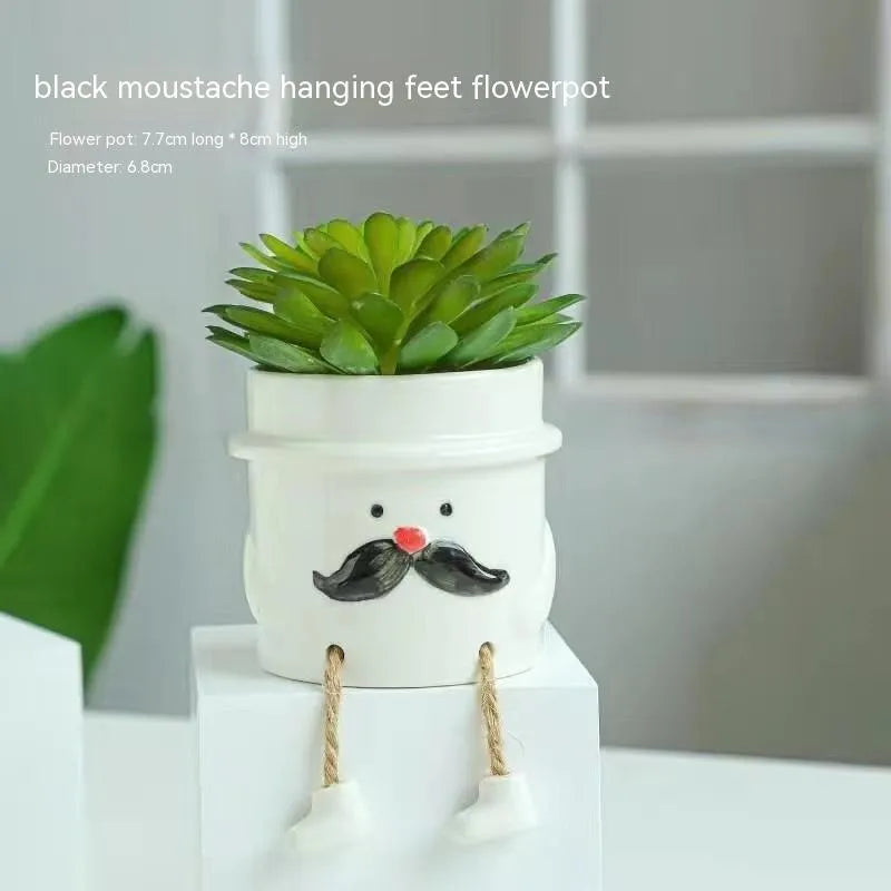 Ceramic hanging foot flowerpot with cartoon design for succulents on desktop