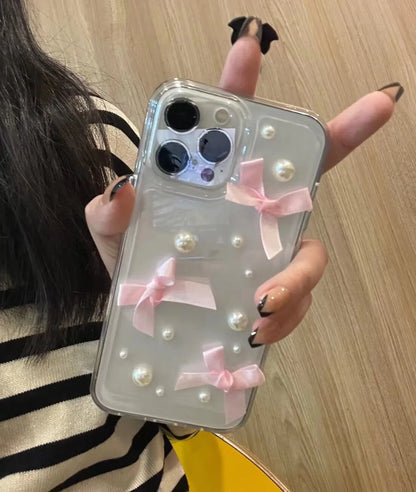 Transparent TPU iPhone case with three-dimensional pearl bow, anti-fall all-inclusive design, colour-matching finish