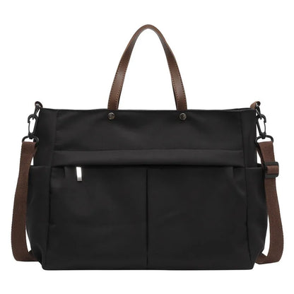 Nylon crossbody bag in five colours with 39x14x28cm dimensions and shoulder strap