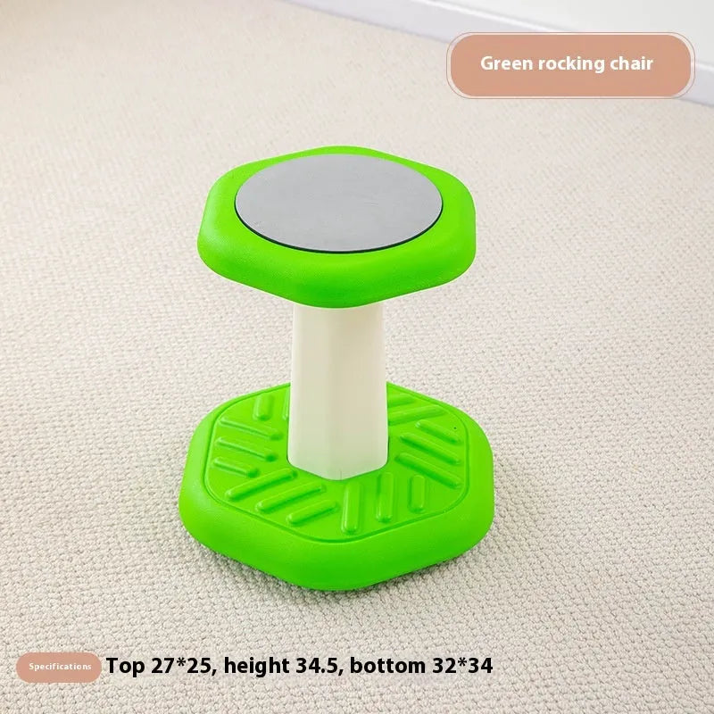 Balance children's plastic rocking stool in blue colour on a wooden floor.