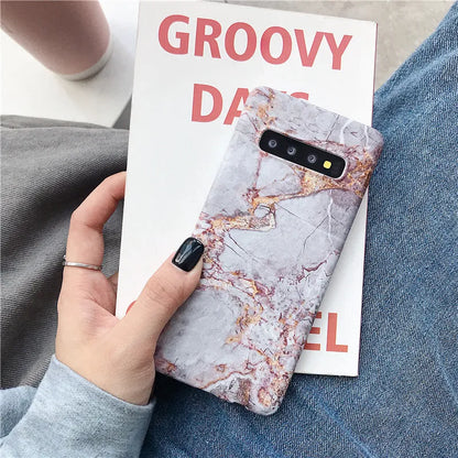 Samsung phone case with white and grey marble pattern on a polycarbonate back cover.