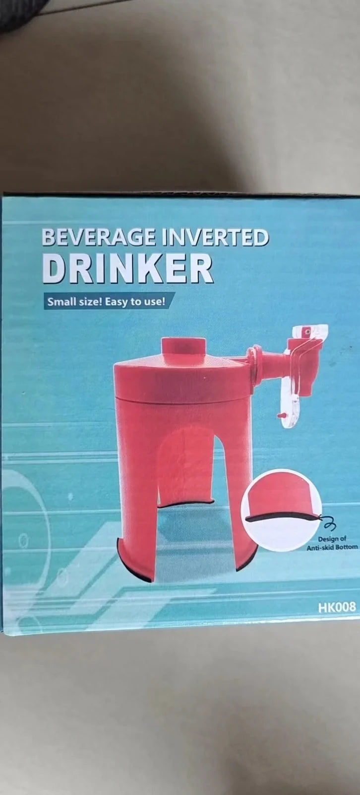 Red automatic soda dispenser gadget attached to beverage bottle for hands-free pouring