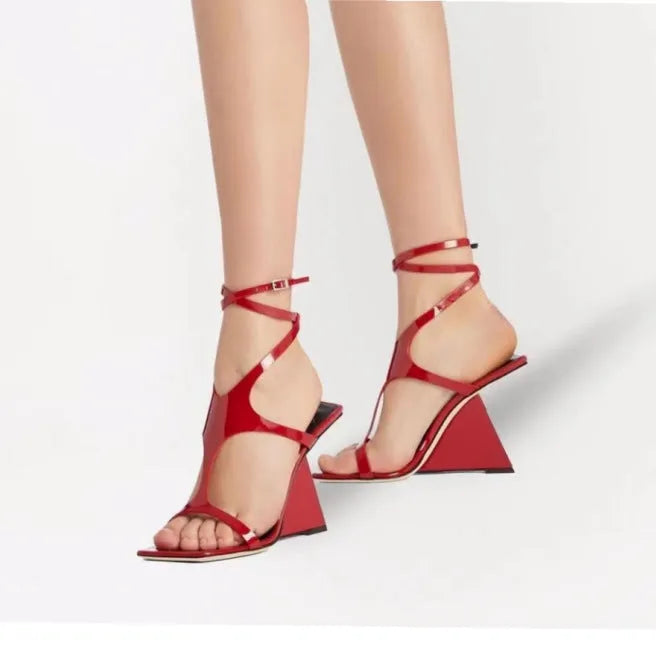 Black women's high heel sandals with a square toe and buckle strap, shown on a white background.