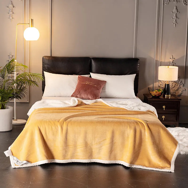 A thick, plain coral fleece blanket in a choice of colours, folded to show its texture.