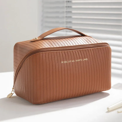 Beige cubic makeup bag with vertical pattern measuring 22.5 by 12.5 by 12.5 centimetres