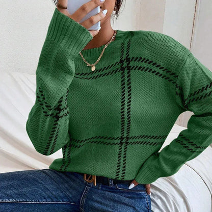 Women's loose-fitting plaid crew neck sweater with apricot, black, beige, red, and green colour-block stripes.