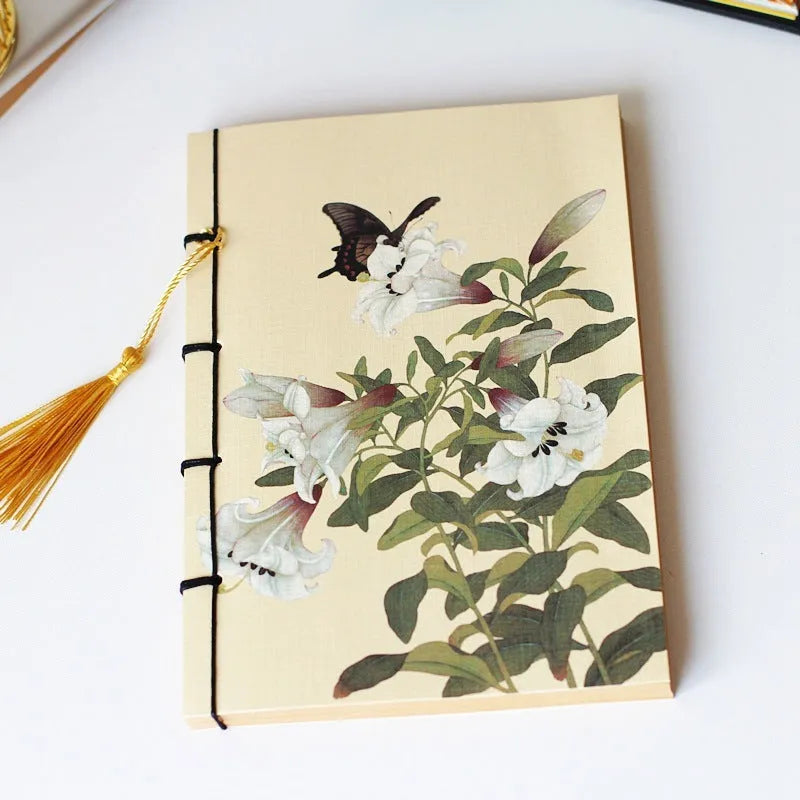 A5 antique wire-bound notebook with classical artwork cover, black oil wax rope binding, and decorative tassels