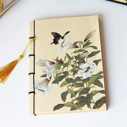 A5 antique wire-bound notebook with classical artwork cover, black oil wax rope binding, and decorative tassels