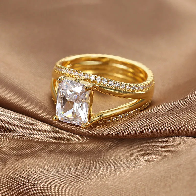 Women's gold-coloured geometric ring with square zircon stone on copper with electroplated finish