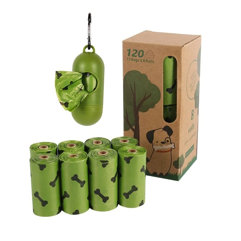 Roll of military green degradable dog poop bags with black bone print, shown next to a plastic dispenser.
