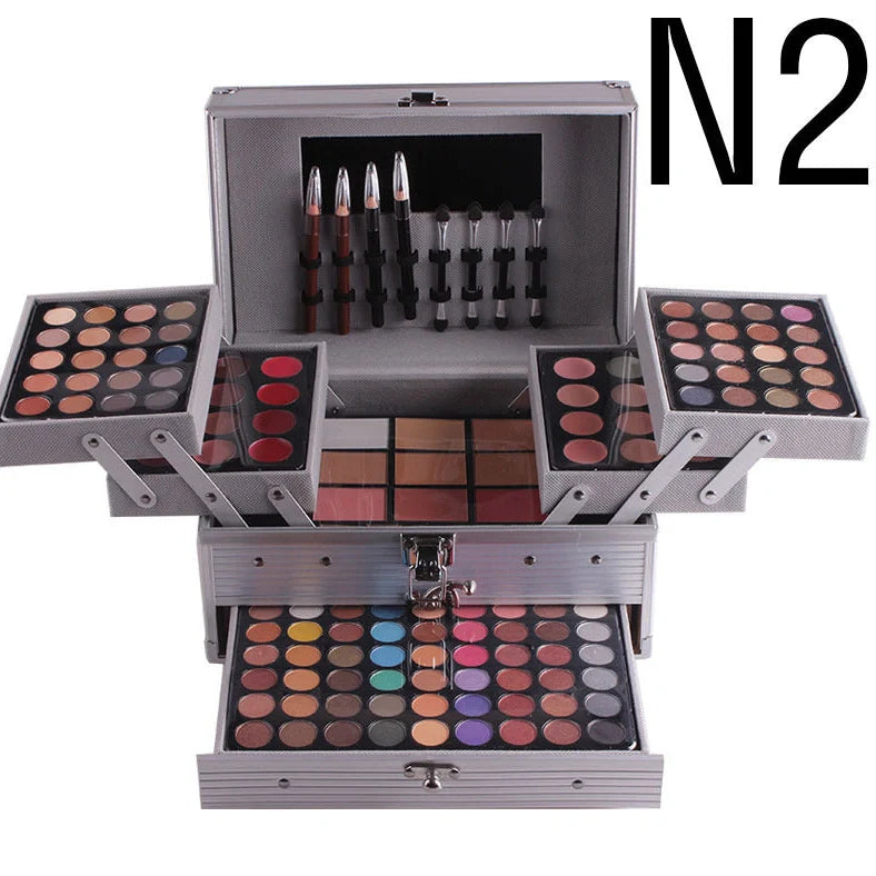 Multifunctional makeup artist kit showing 94 colour eye shadow palette with concealers, lipsticks, and application tools